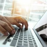 Double,Exposure,Of,Business,Man,Hand,Working,On,Blank,Screen